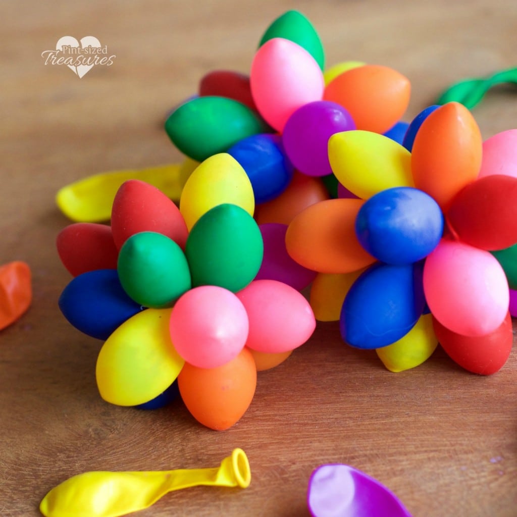 sensory rainbow balloon balls on table