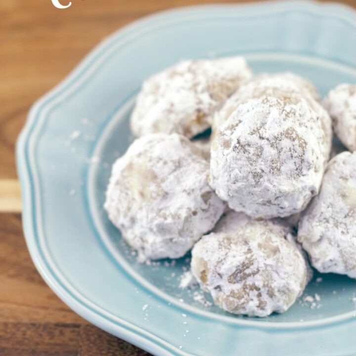 A classic Christmas cookie recipe, snowball cookies, are getting all dressed up with hidden chocolate chips inside every bite! So yummy. So perfect. So cookie-exchange worthy! #chocolatechips #snowballcookies #Christmascookies #holidaycookies #easycookies #chocolatecipsnowballcookies #cookieexchangerecipes #easyChristmascookies #baking #cookiebake