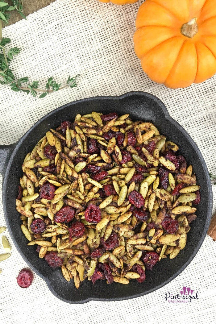 Oooh! These toasted pumpkin seeds with cranberries are a healthy, but indulgent snack for the  holidays! It's perfectly spiced with your fave holiday spices and toasted to perfection. Enjoy pumpkin seeds in a whole new way!