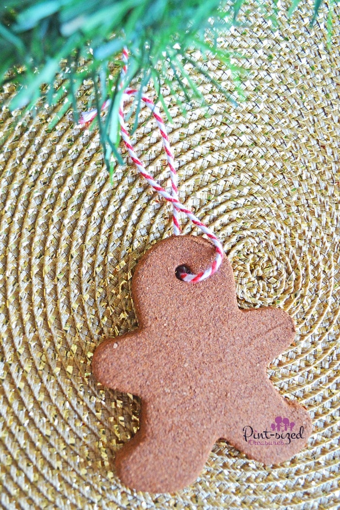 These cinnamon gingerbread ornaments are so easy to make! With just a few ingredients, you're  home will smell and look amazing! A fun Christmas activity that kids and parents love! #DIYOrnaments #Christmasdecor #EasyChristmasCraft