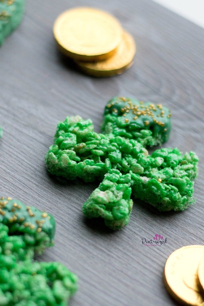 Easy sham rock rice krispie treats pictured with gold chocolate coins