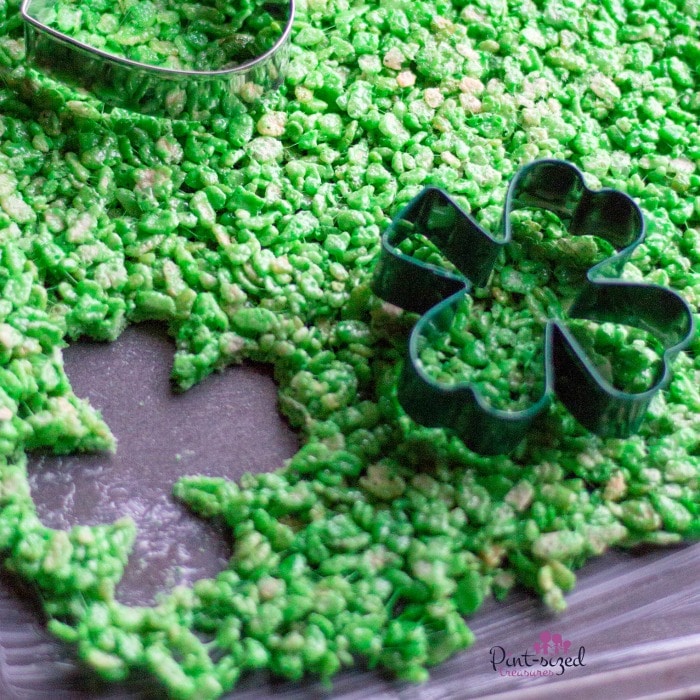 Using the cookie cutter to make rice krispie treats for St. Patrick's Day