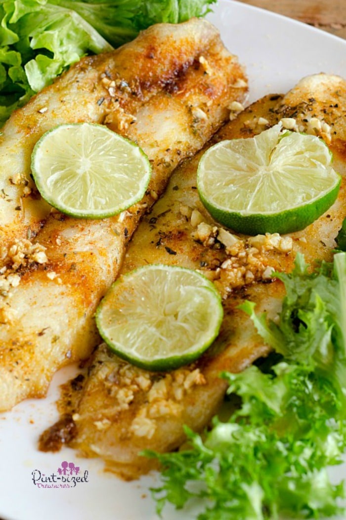 Easy, five-spiced, baked fish is absolutely delicious! t's ready in just minutes and is packed full of fresh flavors and spices! #bakedfishrecipe #easybakedfish #fishrecipes #easymealidea #easydinner #quickandeasymeal #bakedfishmeal  #20minutemeals #familyrecipes