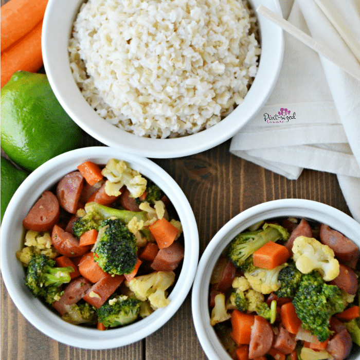 Make this super simple, Sausage and veggie stir-fry recipe for a hearty, easy and yummy meal! Made with fresh veggies and our favorite sausage, it's perfect for busy families and even dinner guests! Grab your chopsticks!