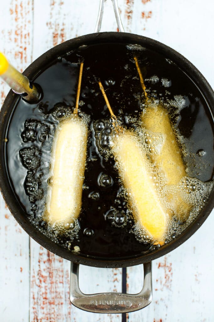 frying homemade corn dogs