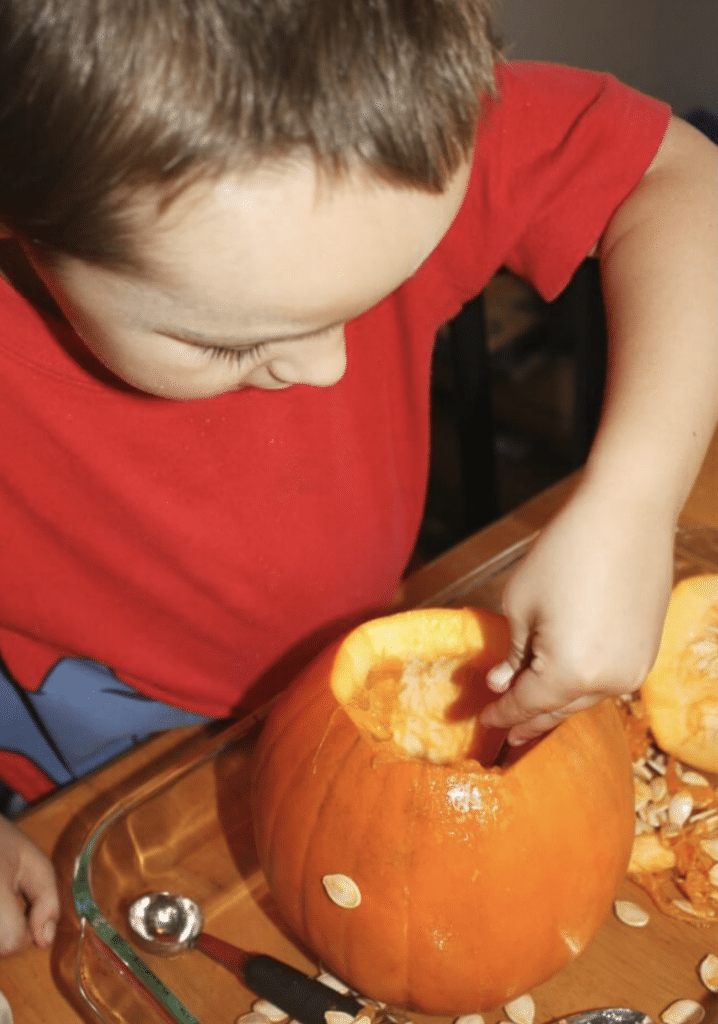 cleaning out pumpkin for a pumpkin craft