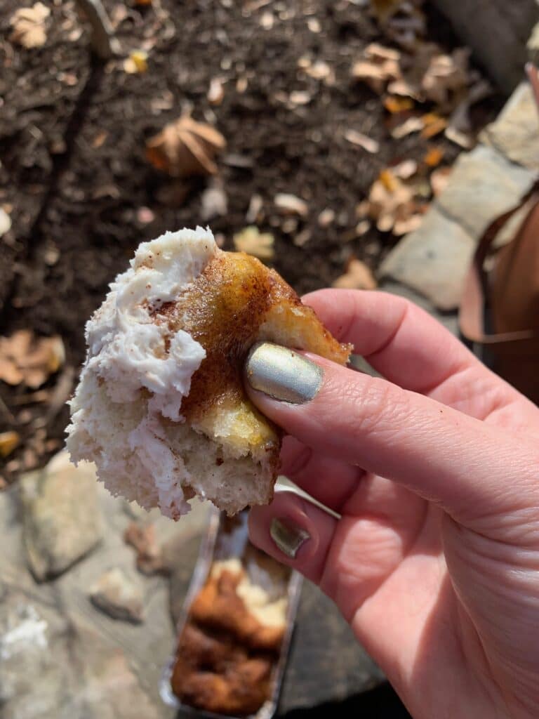 taking a bite of cinnamon bread at Dollywood