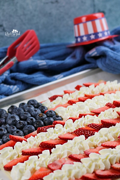 Patriotic American flag fruit pizza made with sugar cookie dough