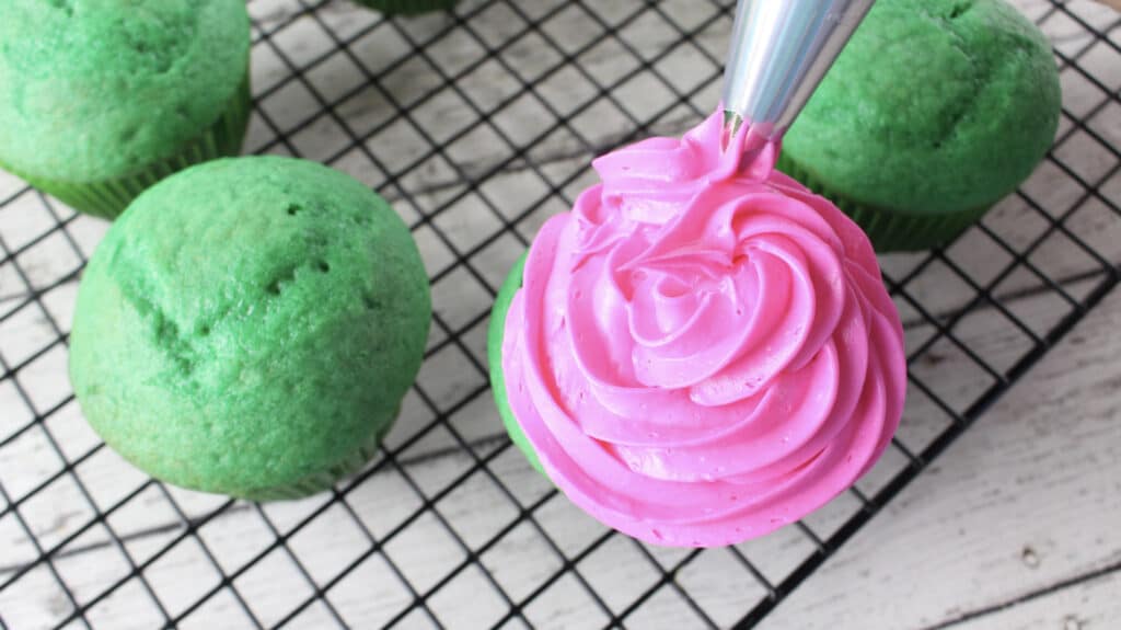 frosting the watermelon cupcakes