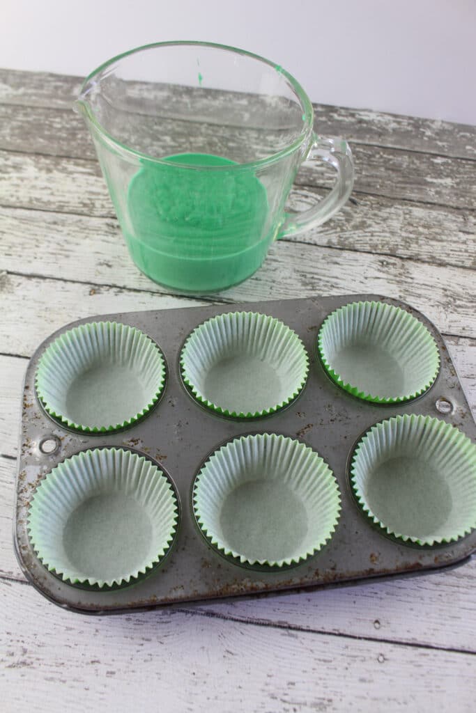 lining muffin pan with cupcake liners for watermelon cupcakes