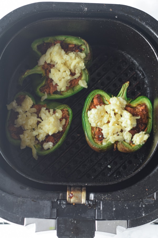 adding cheese to stuffed peppers in the air fryer