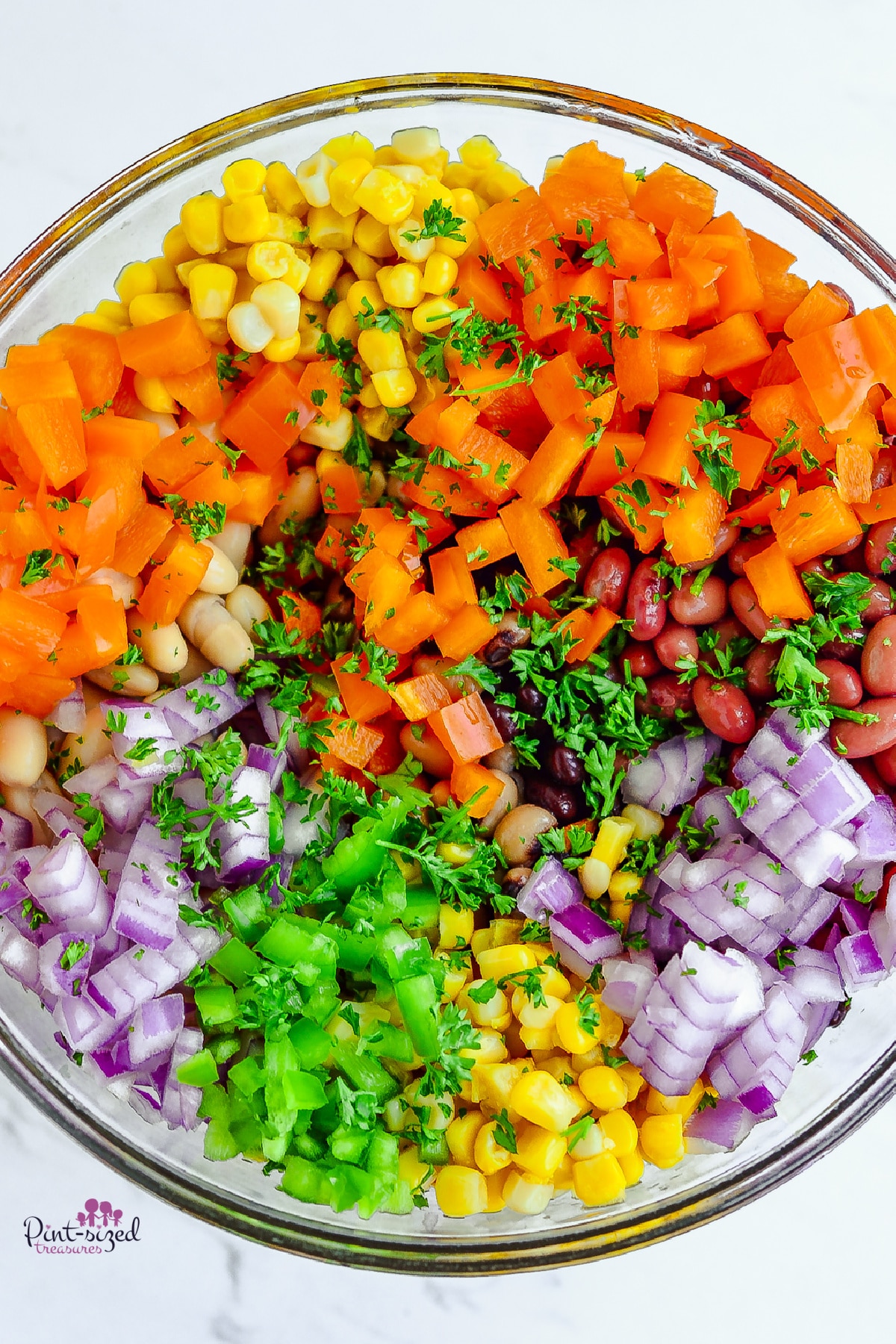 ingredients placed in glass bowl for cowboy caviar