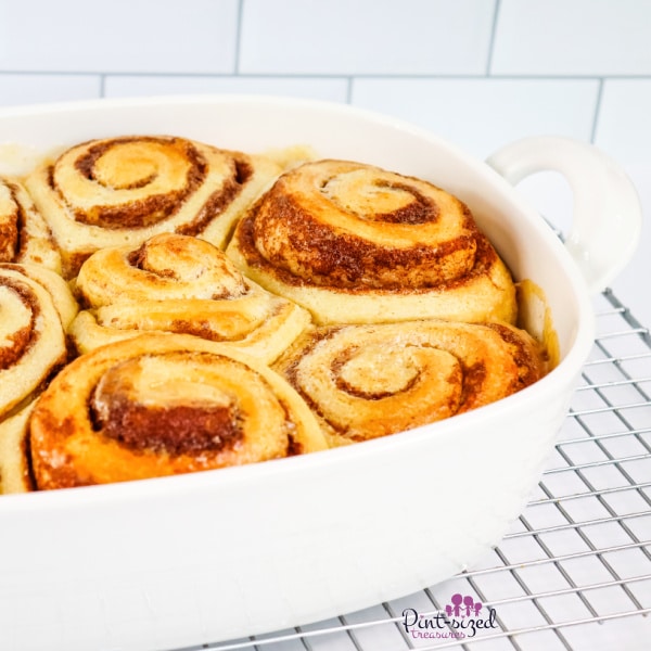 fluffy cinnamon rolls in baking dish