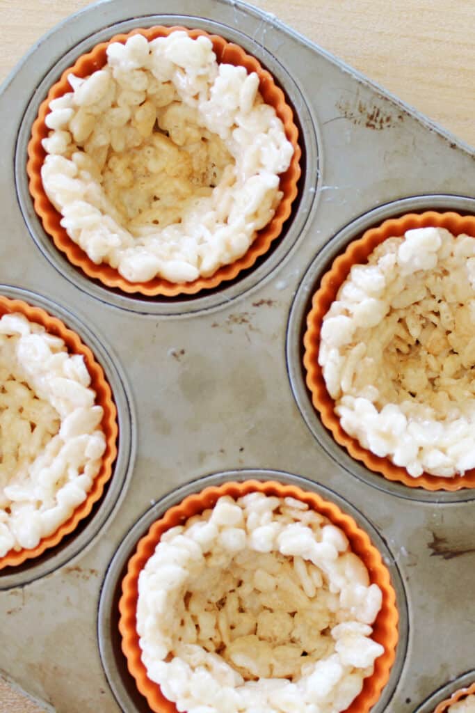 making the crust for Rice Krispie treats pumpkin pies