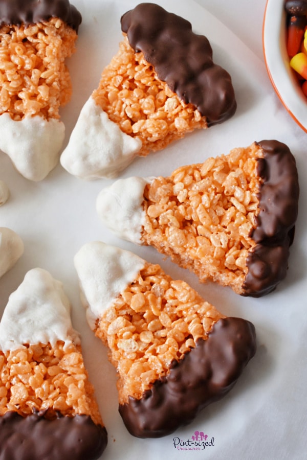 Rice Krispie treats shaped like candy corn and dipped in chocolate