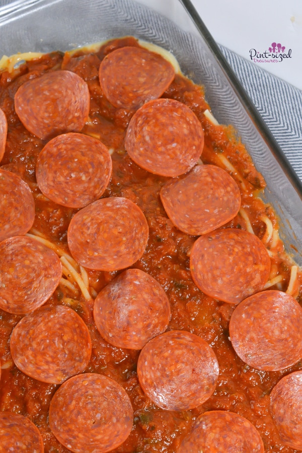 layering pepperoni for pizza spaghetti casserole