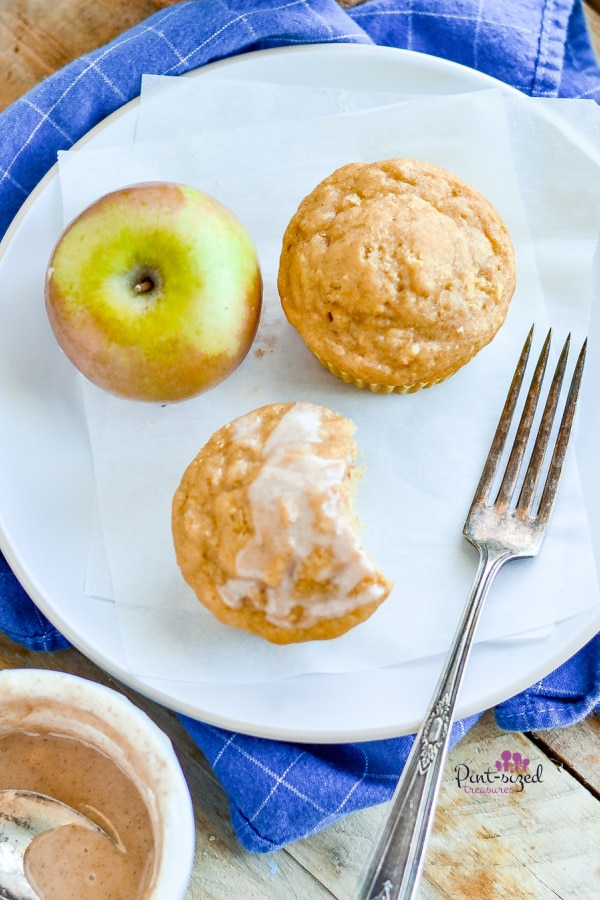 plate of apple muffins with an apple