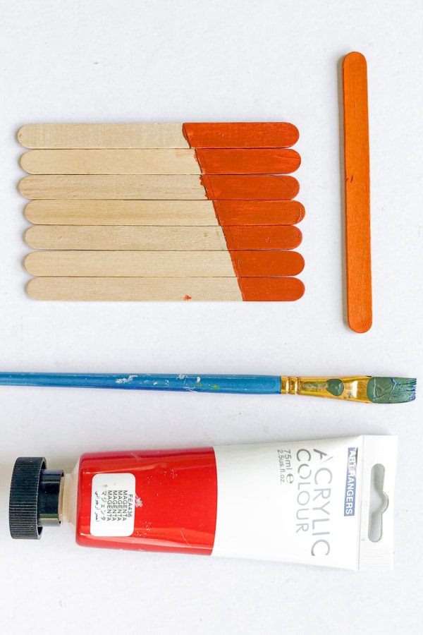 painting craft sticks for scarecrow craft