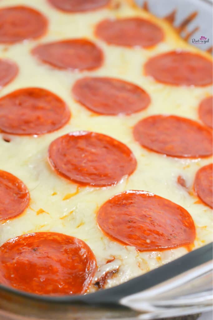 pizza spaghetti casserole with loads of cheese and pepperoni