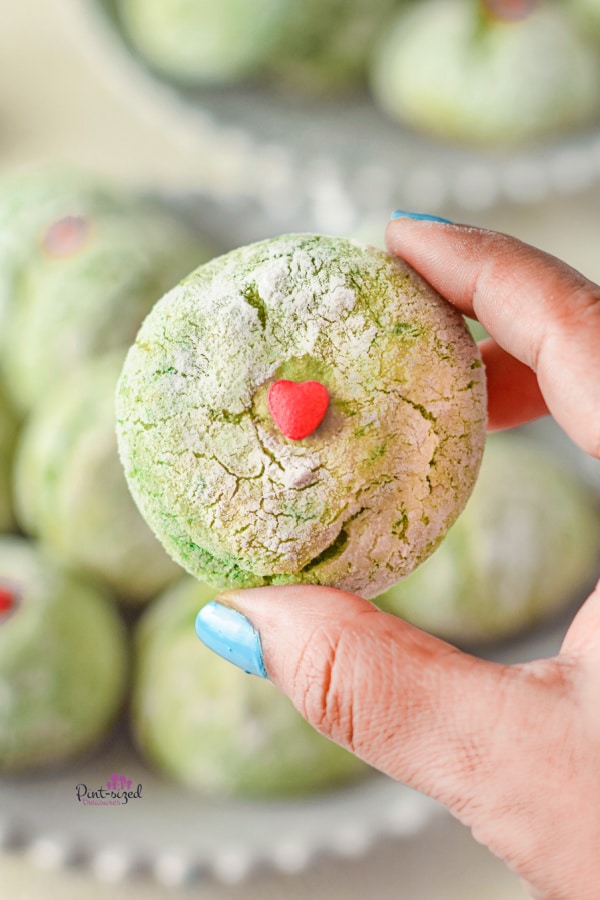 holding a grinch crinkle cookie