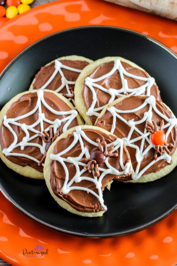 plate full of spider web cookies