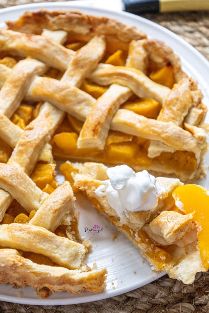 homemade peach pie with whipped cream