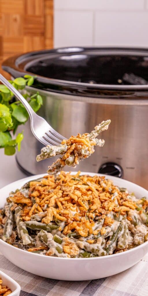 bite of green bean casserole that was cooked in crock pot