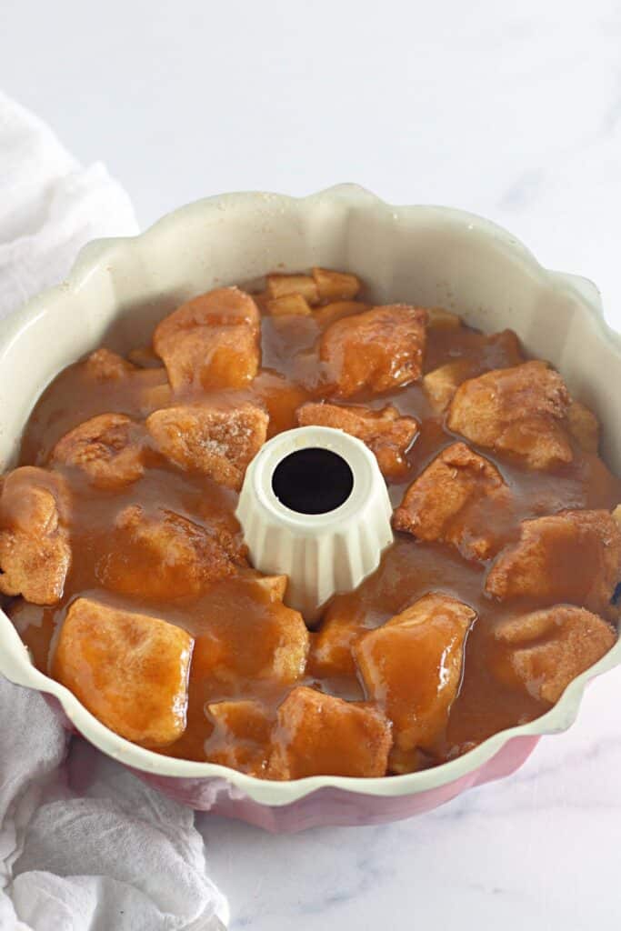 prepping apple fritter monkey bread for baking