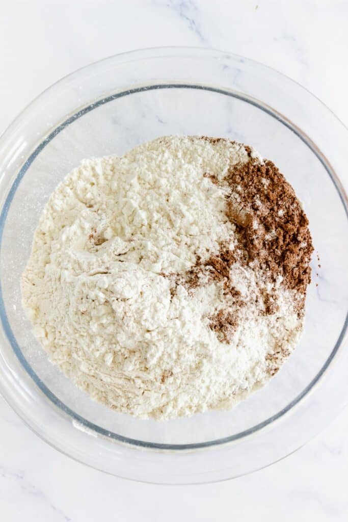 sifting flour together for gingerbread men whoopie pies